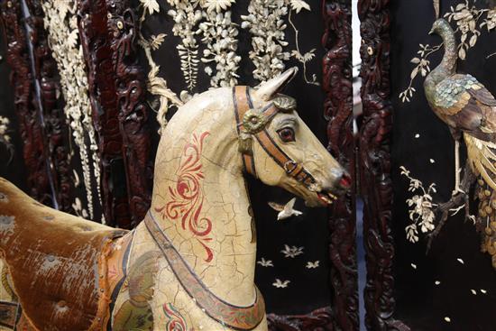 Orton & Spooner. A carved and painted wood carousel horse Jack, H.4ft 5in. Overall L.7ft 4in.